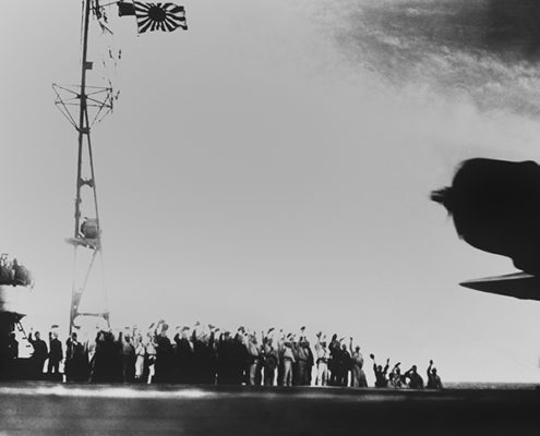 Crews Wave From Japanese Aircraft Carrier