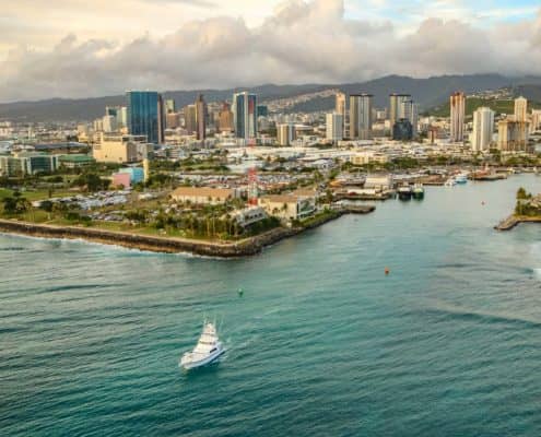 A Boat Leaves Honolulu Harbor