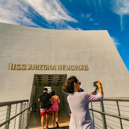 Woman Taking Photo at Arizona Memorial Entrance