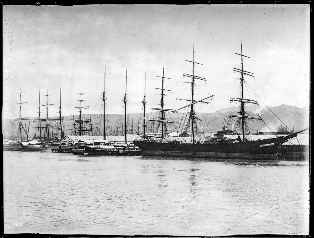 Sailing vessels at wharf in Honolulu harbor, ca.  USC