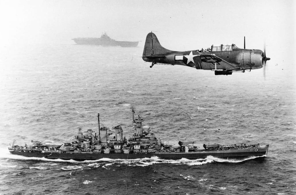 SBD Dauntless over USS Washington andUSSLexington