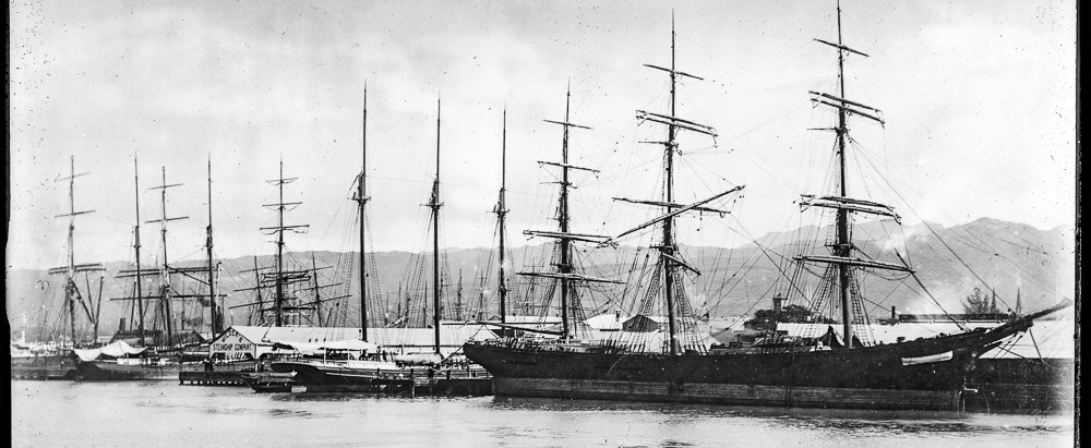 Sailing_vessels_at_wharf_in_Honolulu_harbor,_ca.1892-1907_USC