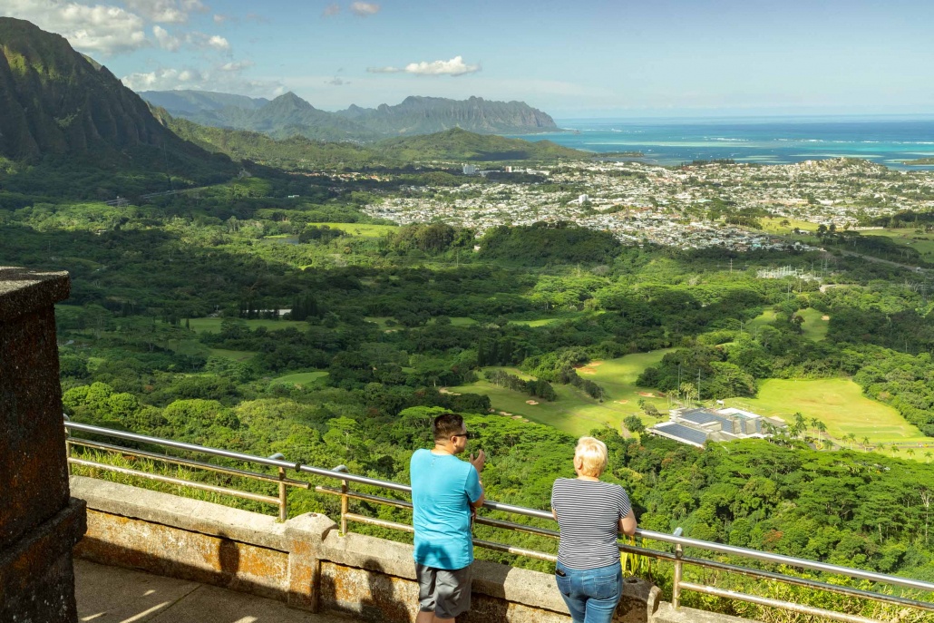 Visitors stand at the iconic Nuuanu Pali Lookout