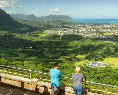 Visitors stand at the iconic Nuuanu Pali Lookout