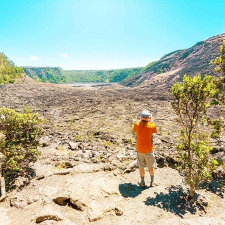 hikers in kilauea iki crater volcanoes national park big island hawaii