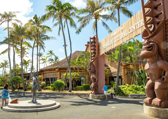 polynesian cultural center entrance and the statue oahu hawaii slider